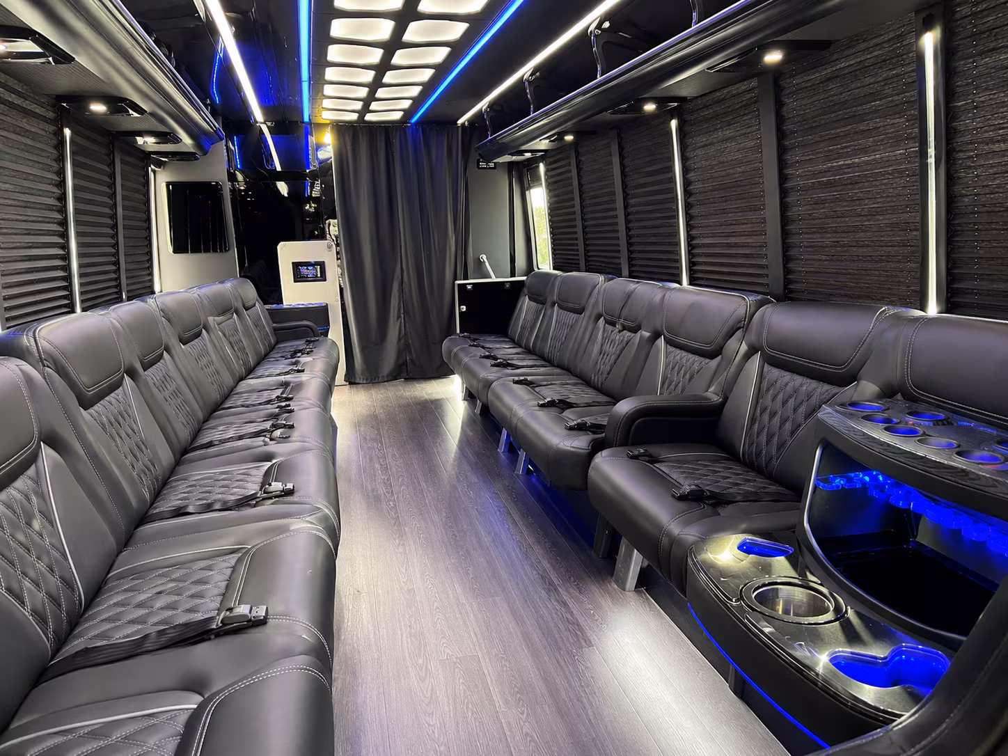 Friends laughing during a party bus celebration in Miami