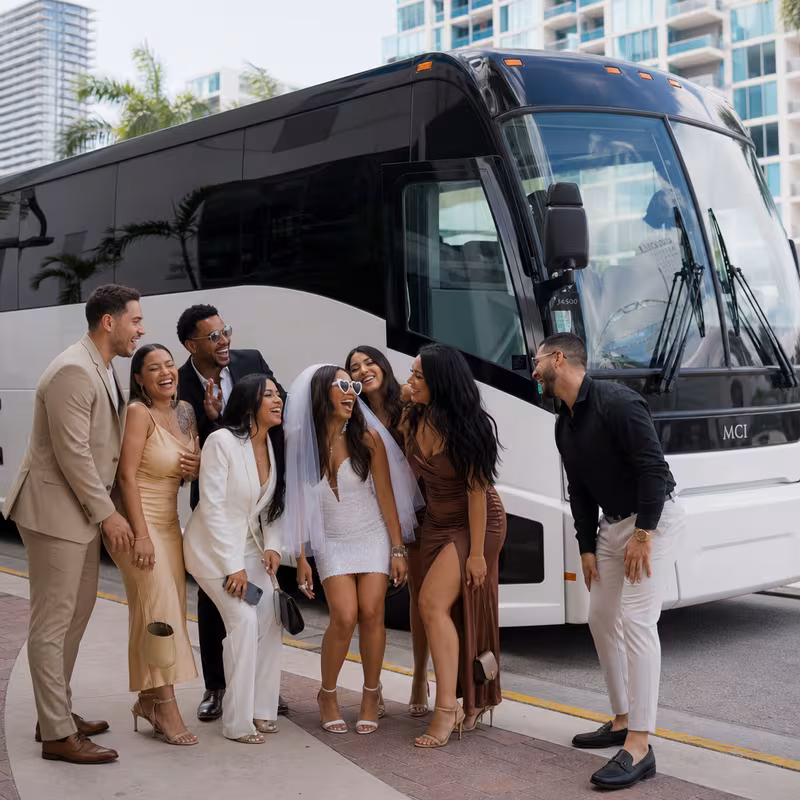 Passengers loading luggage while boarding an Miami group shuttle