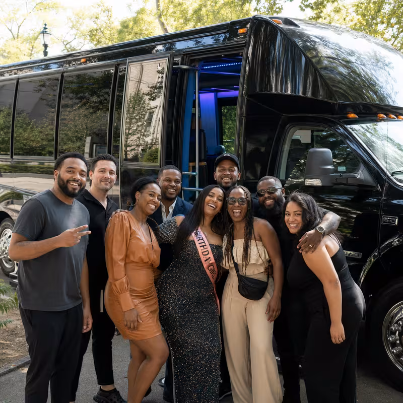 Party bus interior with wraparound leather seating and LED lighting in Miami