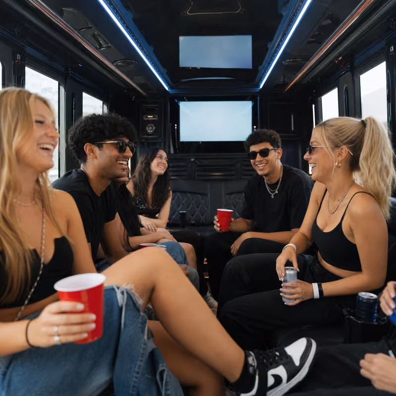 Passengers loading luggage while boarding an Miami group shuttle