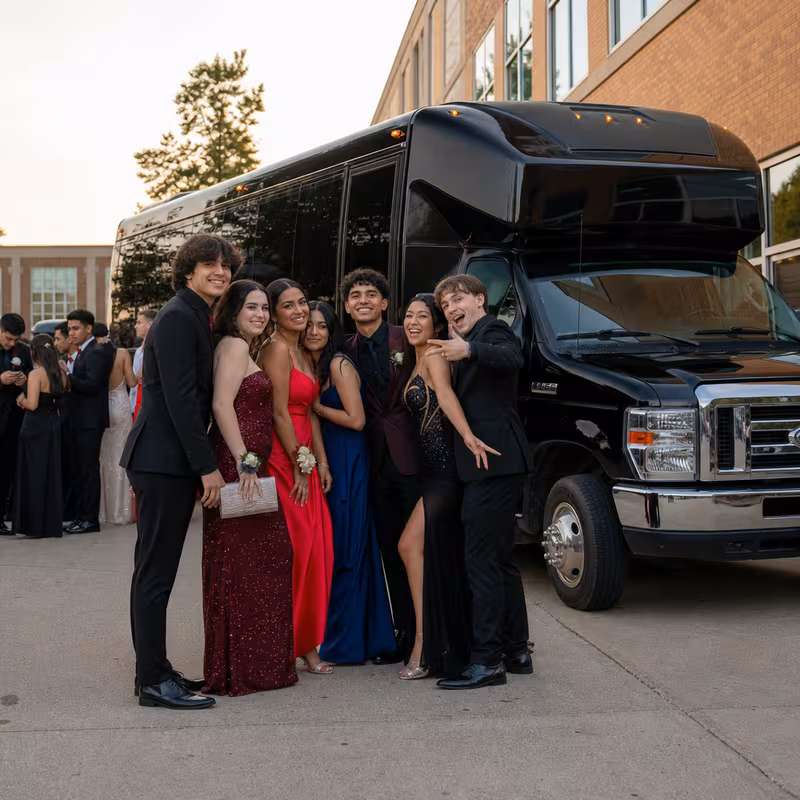 Group boarding a white charter bus for Prom & Homecoming Transportation transportation in Miami