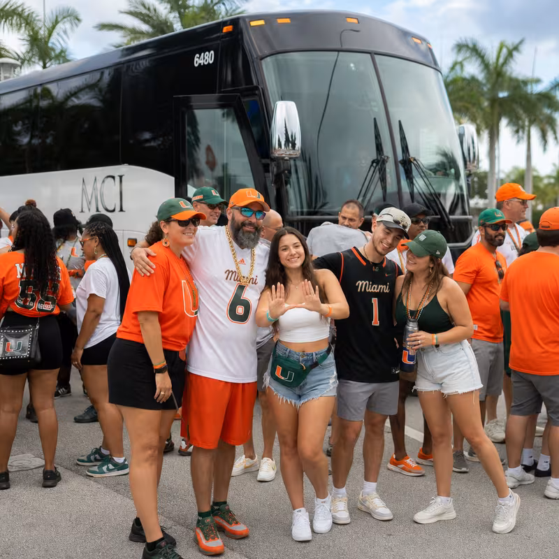 Passengers loading luggage while boarding an Miami group shuttle