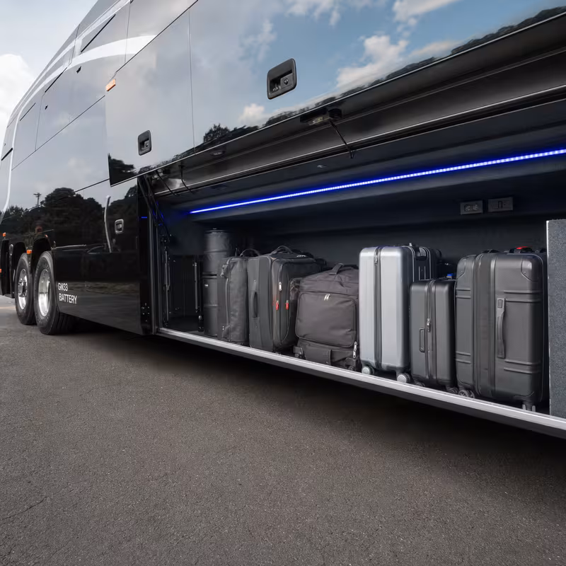 Party bus interior with wraparound leather seating and LED lighting in Miami