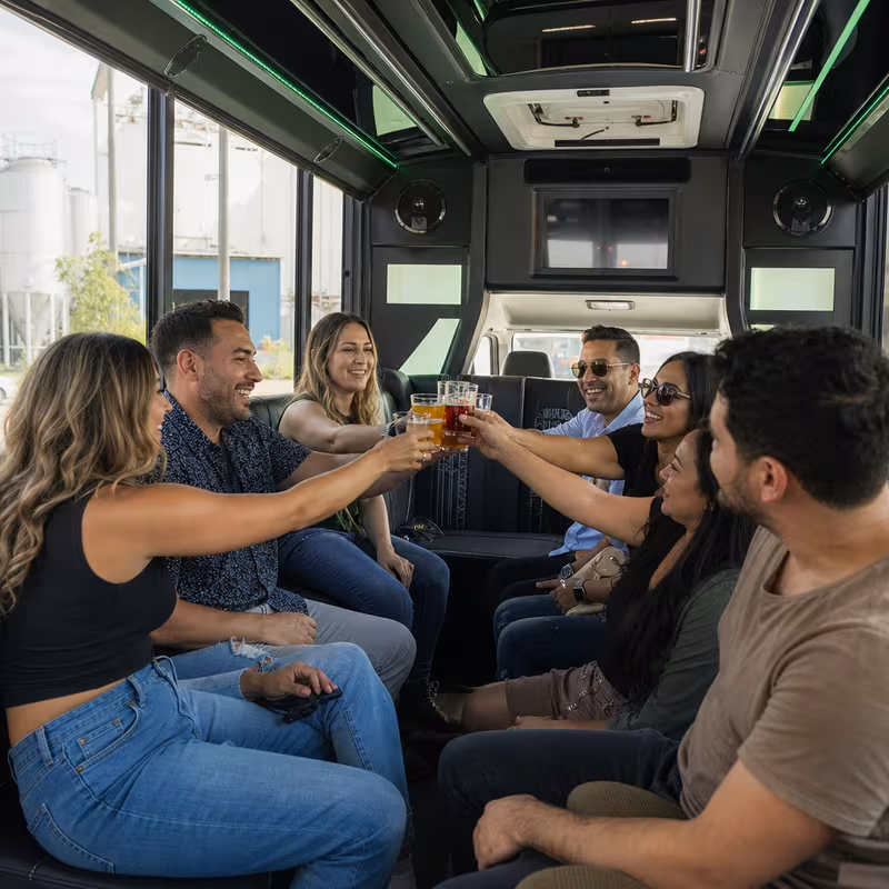 Group boarding a white charter bus for Winery & Brewery Tour Transportation transportation in Miami